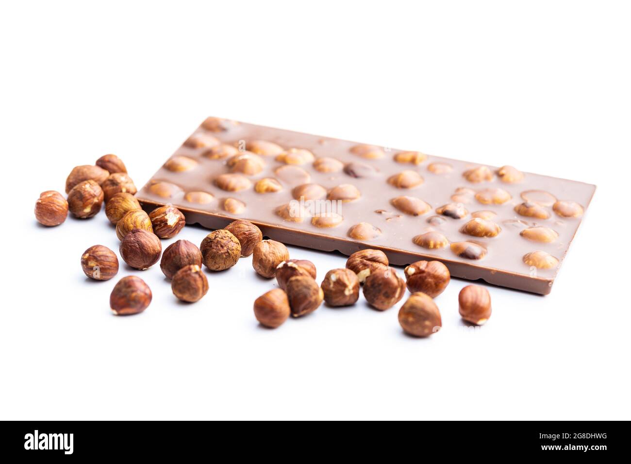 Chocolate bar with hazelnuts isolated on white background. Stock Photo