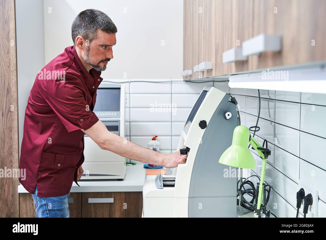 Professional optician using modern hi-res stock photography and images ...