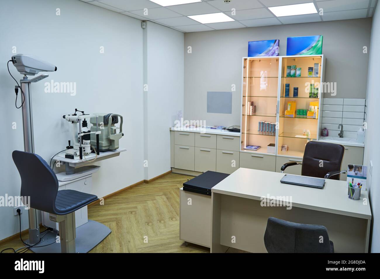 Optician office with work table and optometry equipment Stock Photo - Alamy