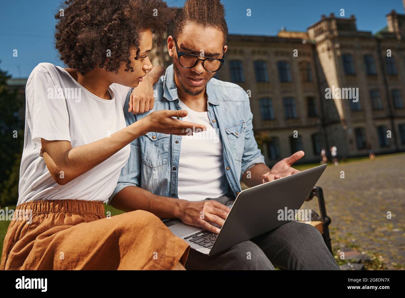 Young couple having different opinions and discussing them Stock Photo