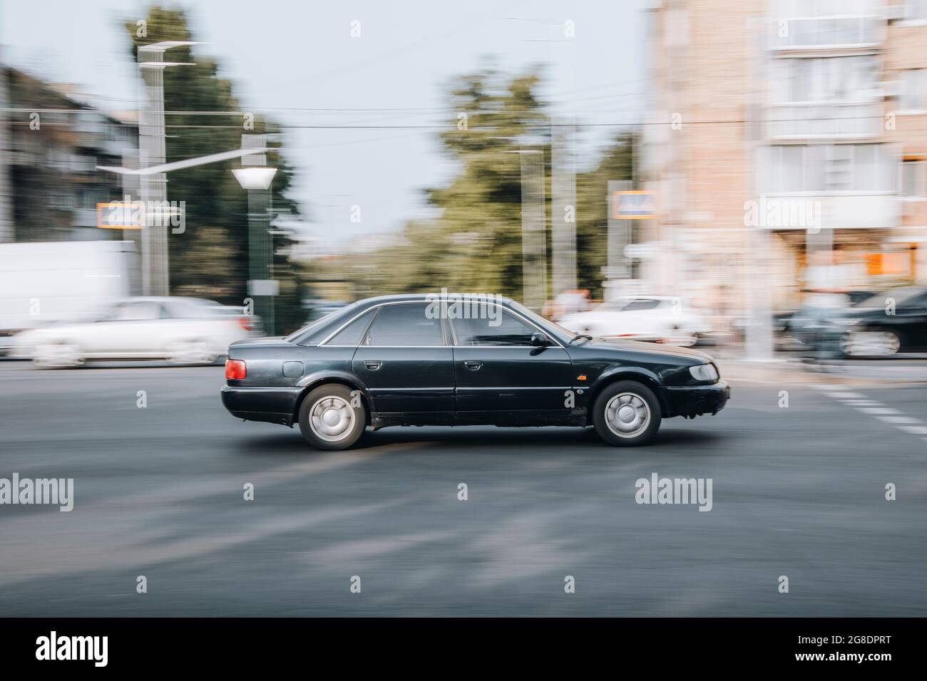 Ukraine, Kyiv - 16 July 2021: Black Audi 100 car moving on the street. Editorial Stock Photo