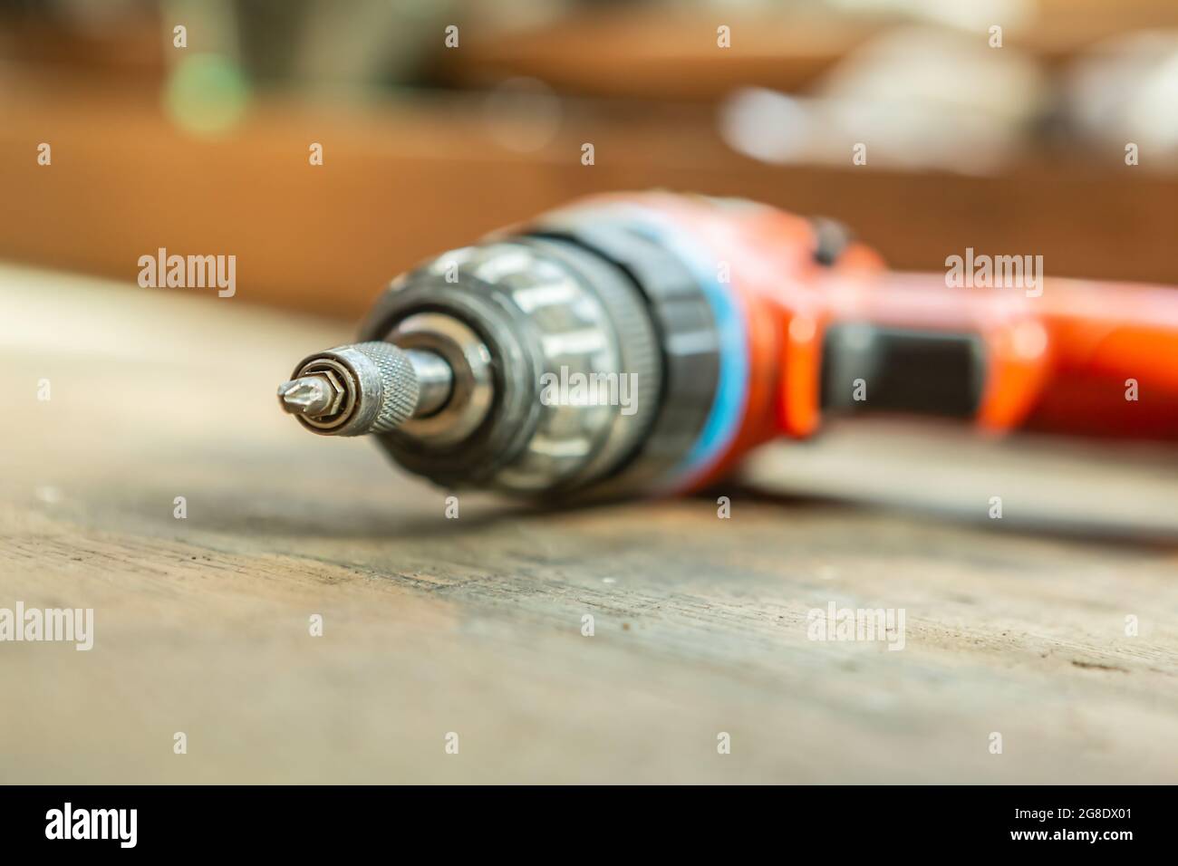 Close-up of a cordless screwdriver on a workbench Stock Photo