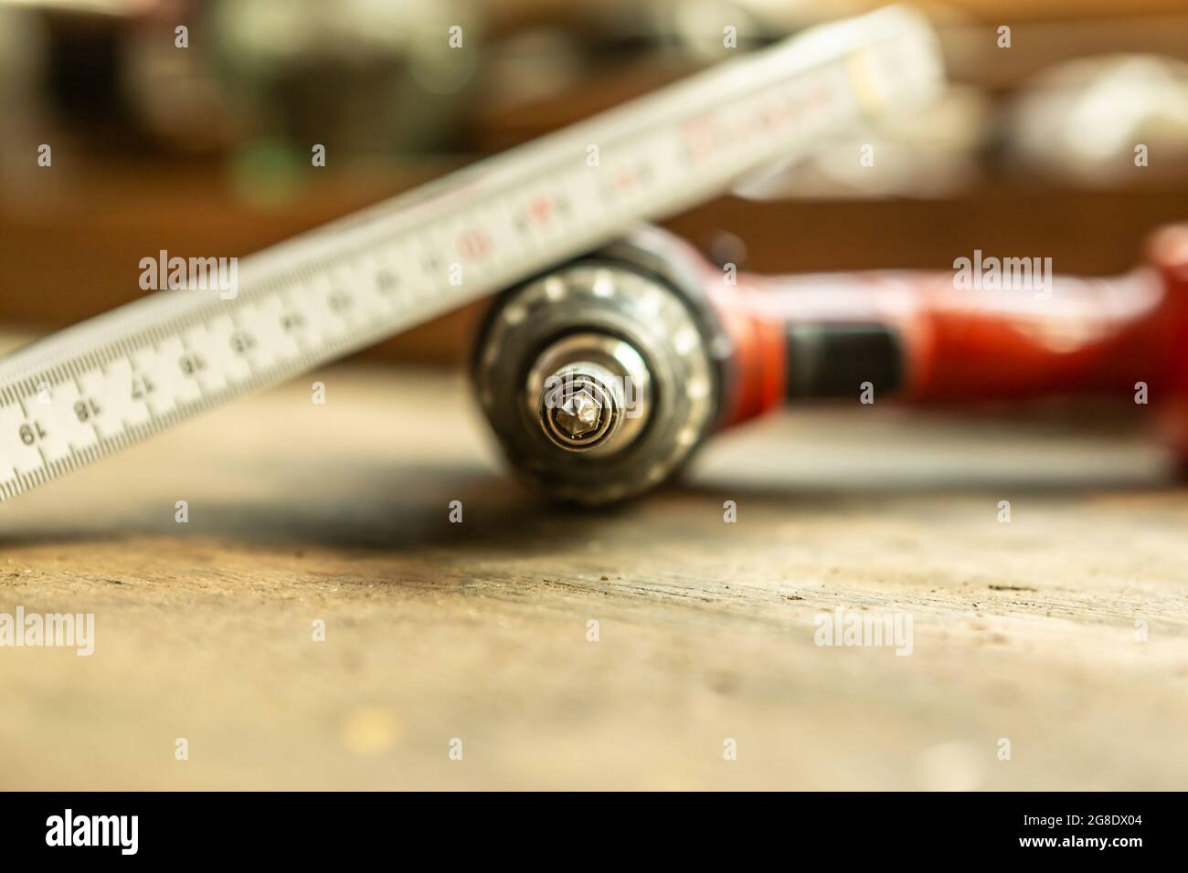 Close-up of a cordless screwdriver on a workbench Stock Photo