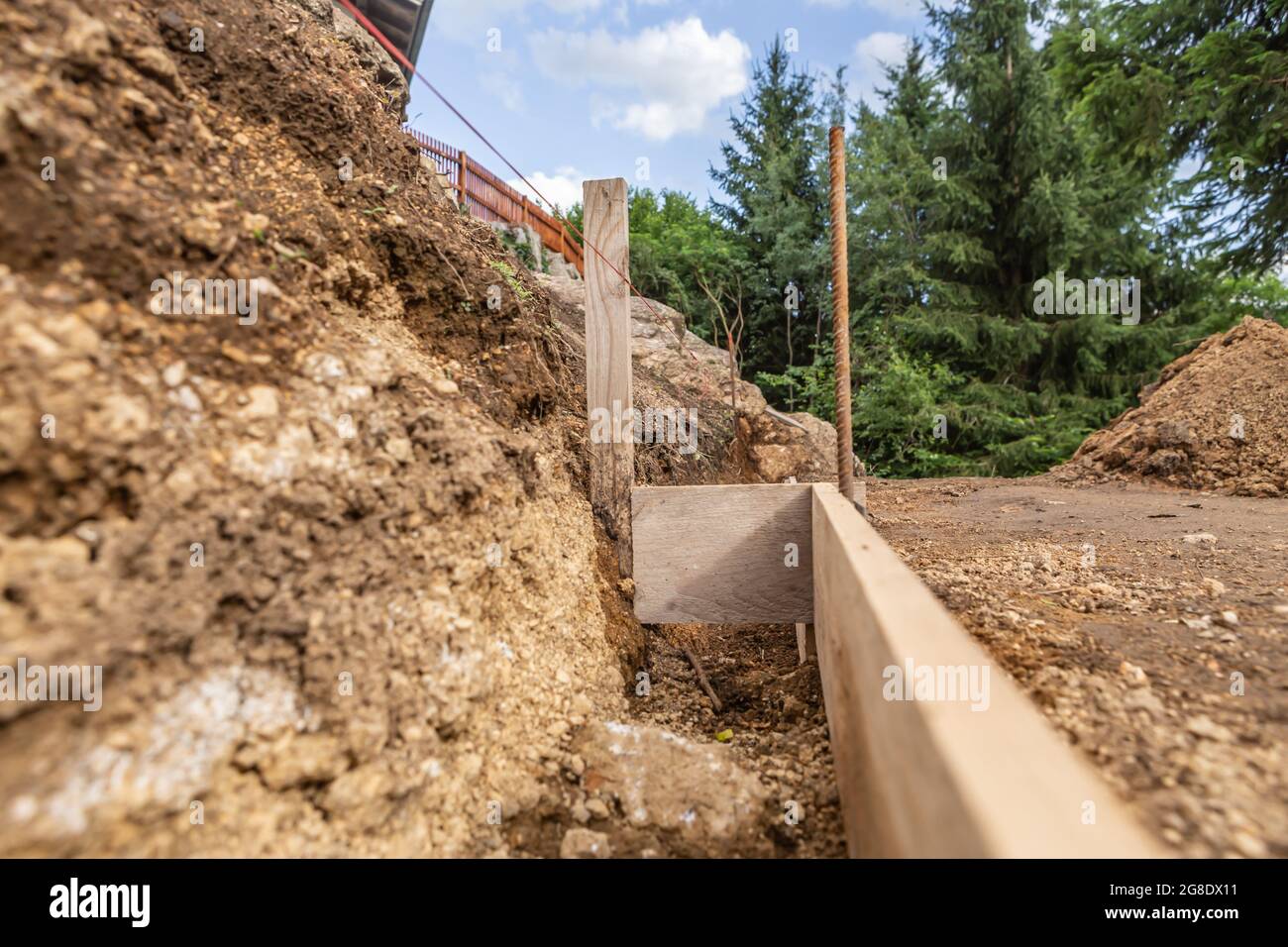 Construction planning in a garden to lay bricks to build a wall Stock Photo