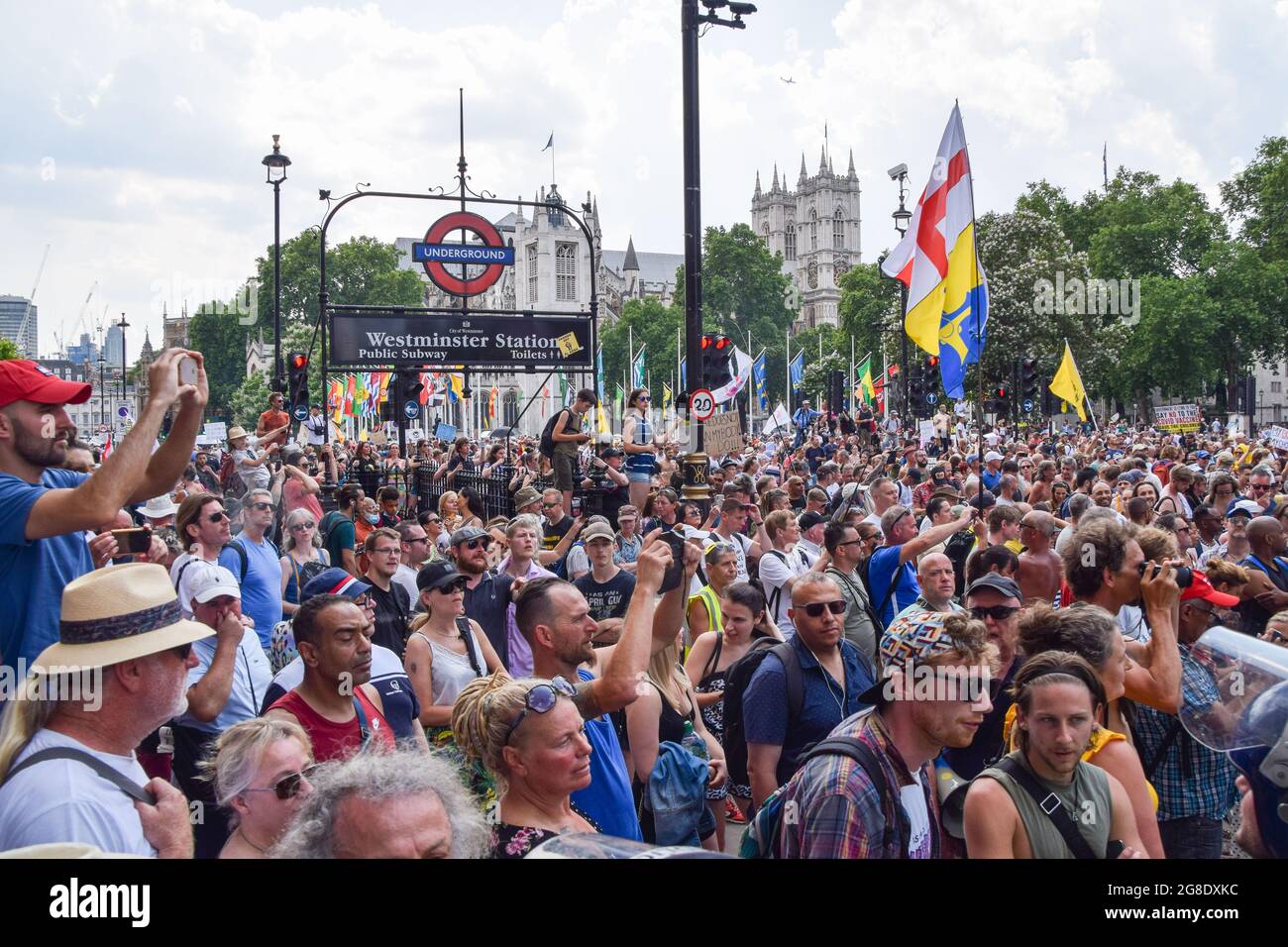 London, UK. 19th July, 2021. Crowds of protesters gather around Westminster Station during the demonstration in Parliament Square.Demonstrators gathered in Westminster on Freedom Day, the day on which the majority of coronavirus restrictions have been lifted in England, to protest against COVID-19 vaccinations, vaccine passports and all remaining restrictions. (Photo by Vuk Valcic/SOPA Images/Sipa USA) Credit: Sipa USA/Alamy Live News Stock Photo