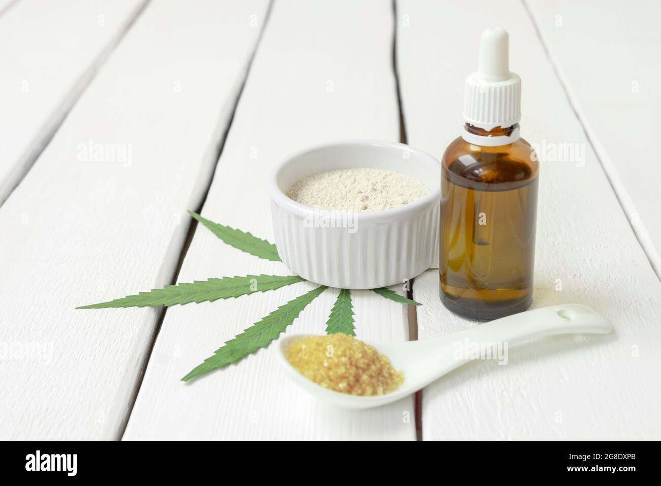 Premium Photo  Top view of marijuana buds with grinder accessories glass  bottles and white background