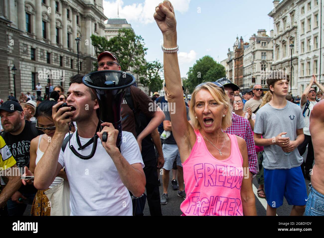 London, UK. 19th July, 2021. A demonstrator chants slogans on a megaphone during the protest.Anti-vaccination and anti-Covid restrictions demonstrators march to Parliament Square. They say the coronavirus pandemic is a hoax and protest against the idea of vaccine passports. (Photo by Thabo Jaiyesimi/SOPA Images/Sipa USA) Credit: Sipa USA/Alamy Live News Stock Photo