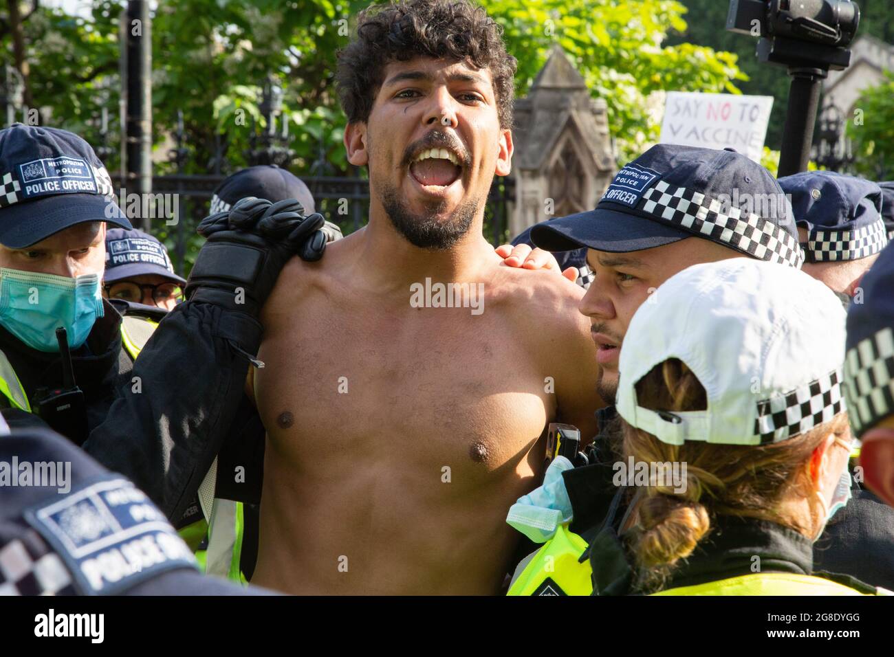 London, UK. 19th July, 2021. A protester is arrested after clashing with police during an anti-vaccination protest.Anti-vaccination and anti-Covid restrictions demonstrators march to Parliament Square. They say the coronavirus pandemic is a hoax and protest against the idea of vaccine passports. (Photo by Thabo Jaiyesimi/SOPA Images/Sipa USA) Credit: Sipa USA/Alamy Live News Stock Photo