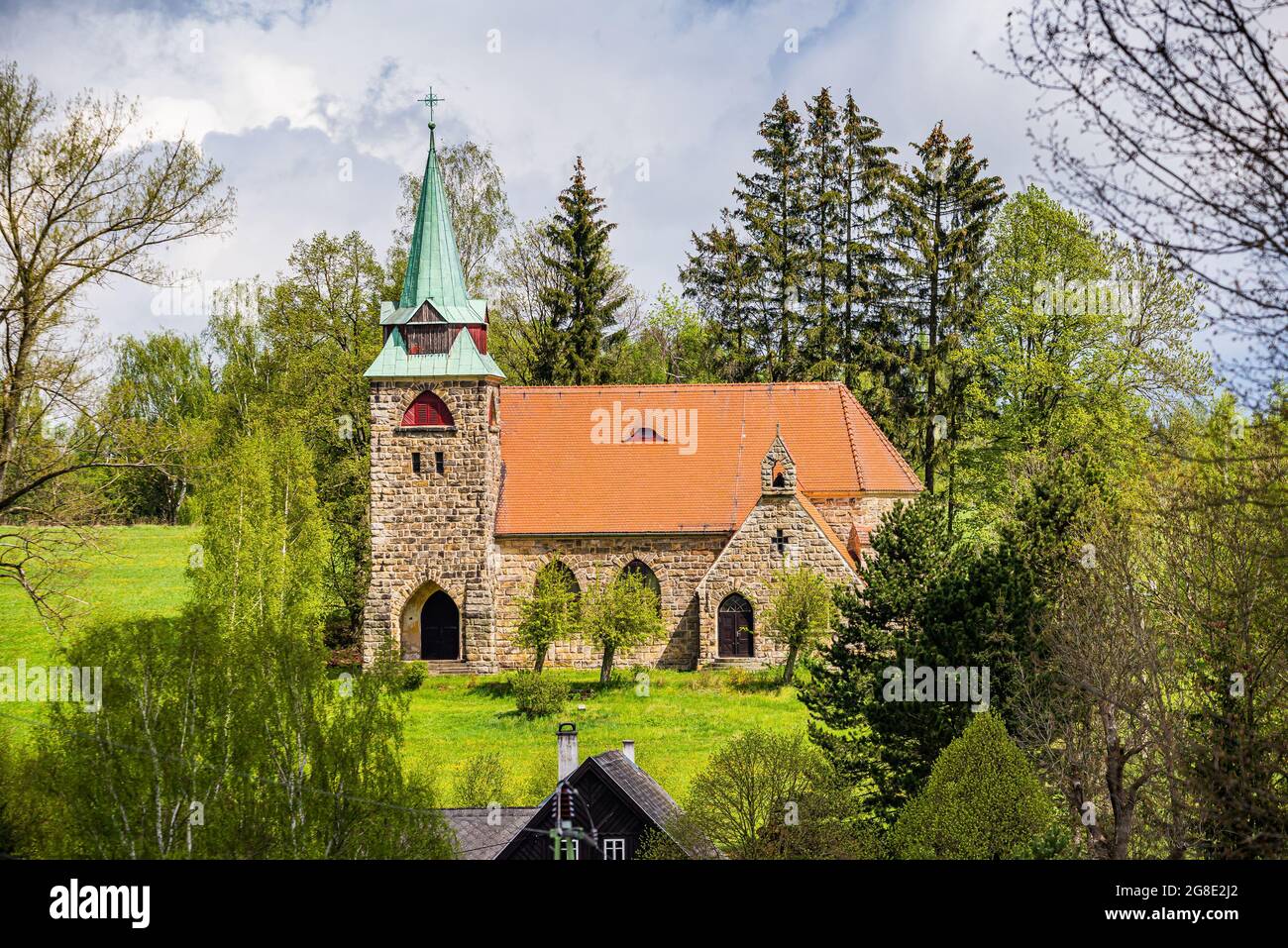Romantic neo gotic Church Of The Divine Heart Of The Lord in small village Borovnicka in Podkrkonosi region in Spring Stock Photo
