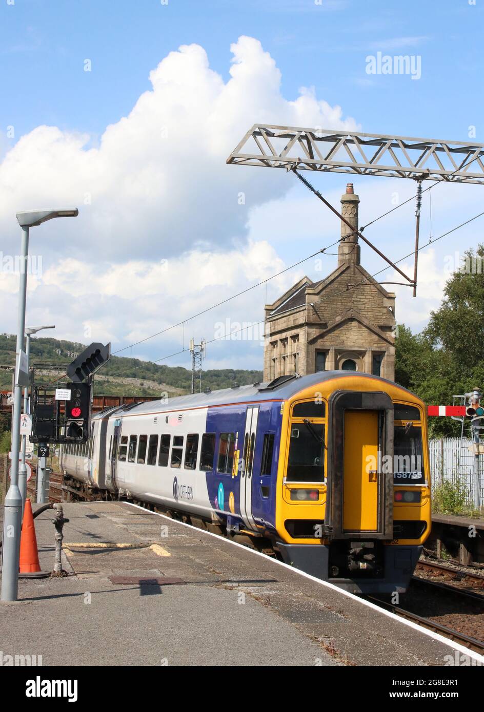 Northern three car class 158 express sprinter dmu, number 158 755, leaving Carnforth railway station on Monday 19th July 2021 with passenger train. Stock Photo