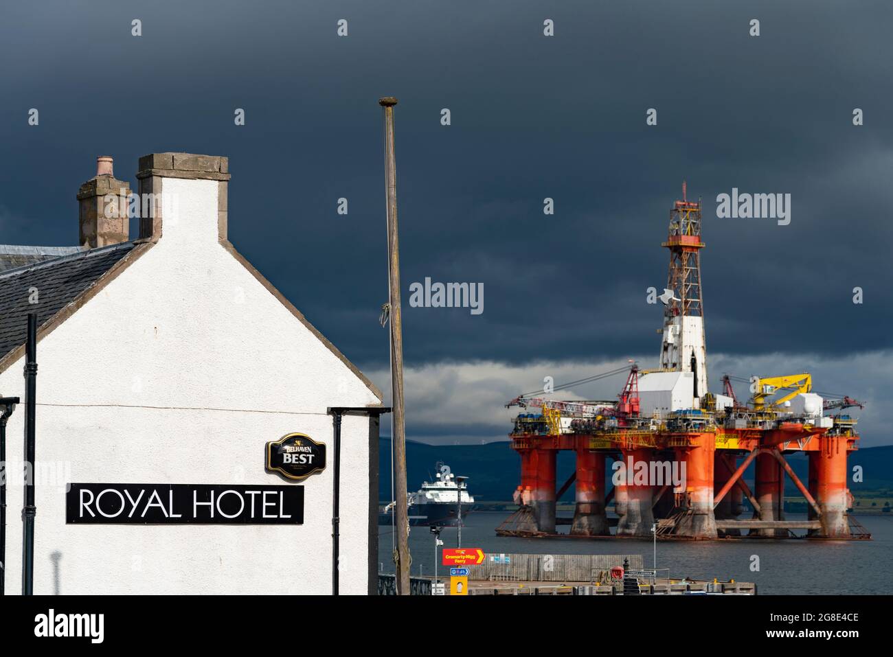 Royal Hotel and moored oil rig at Cromarty village on Black Isle on Cromarty Firth, Ross and Cromarty, Scotland, UK Stock Photo
