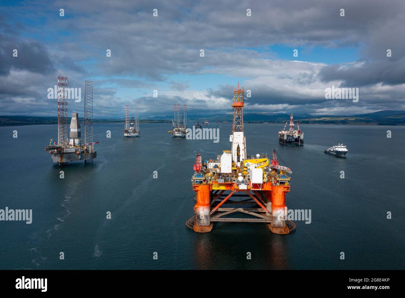 North Sea Oil and gas industry platforms and drilling rigs mothballed and moored in Nigg Bay in Cromarty Firth, Ross and Cromarty, Scotland, UK Stock Photo