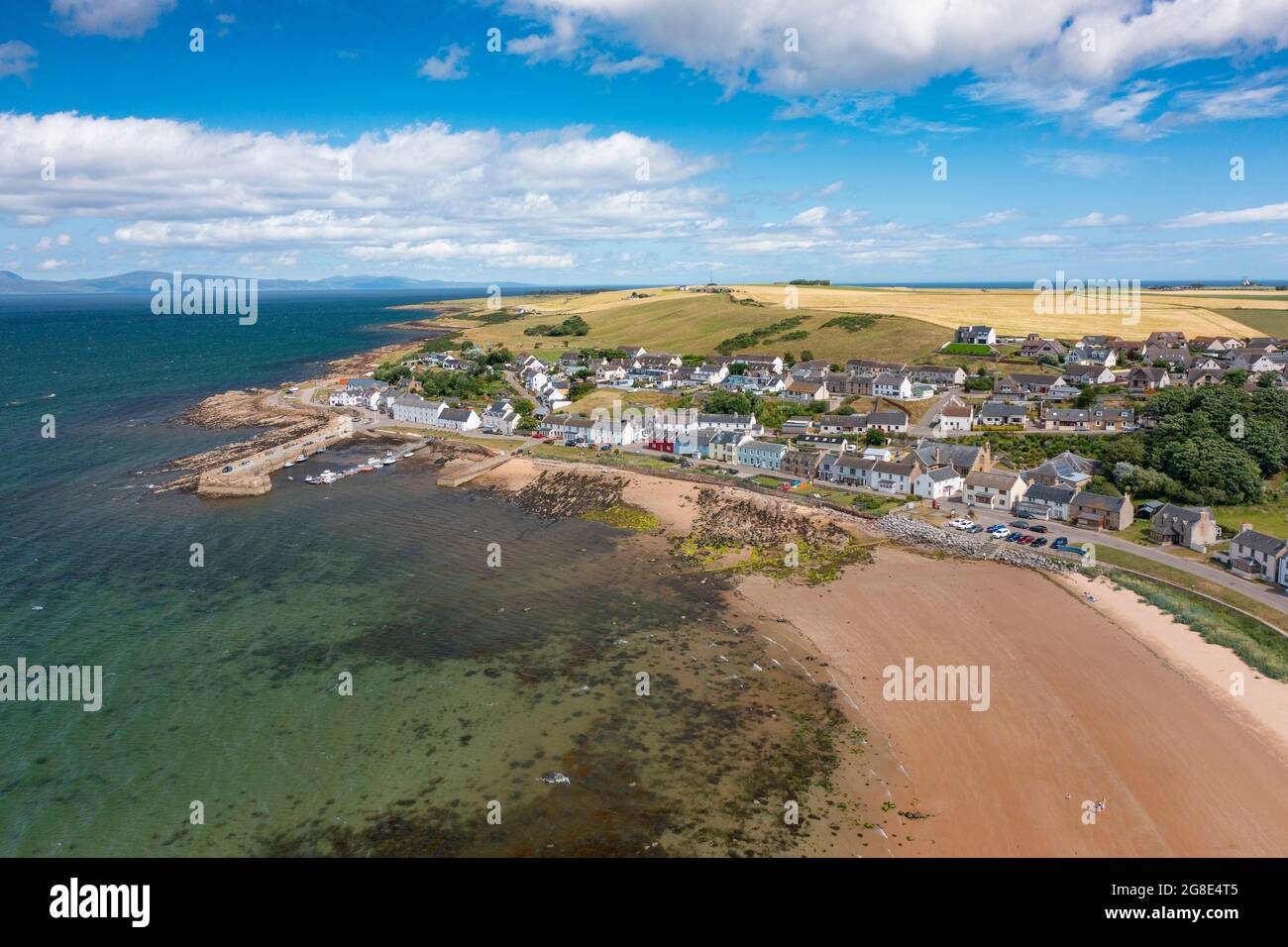 Aerial view from drone of Portmahomack village and beach, on Tarbat peninsula, Easter Ross, Scotland, UK Stock Photo