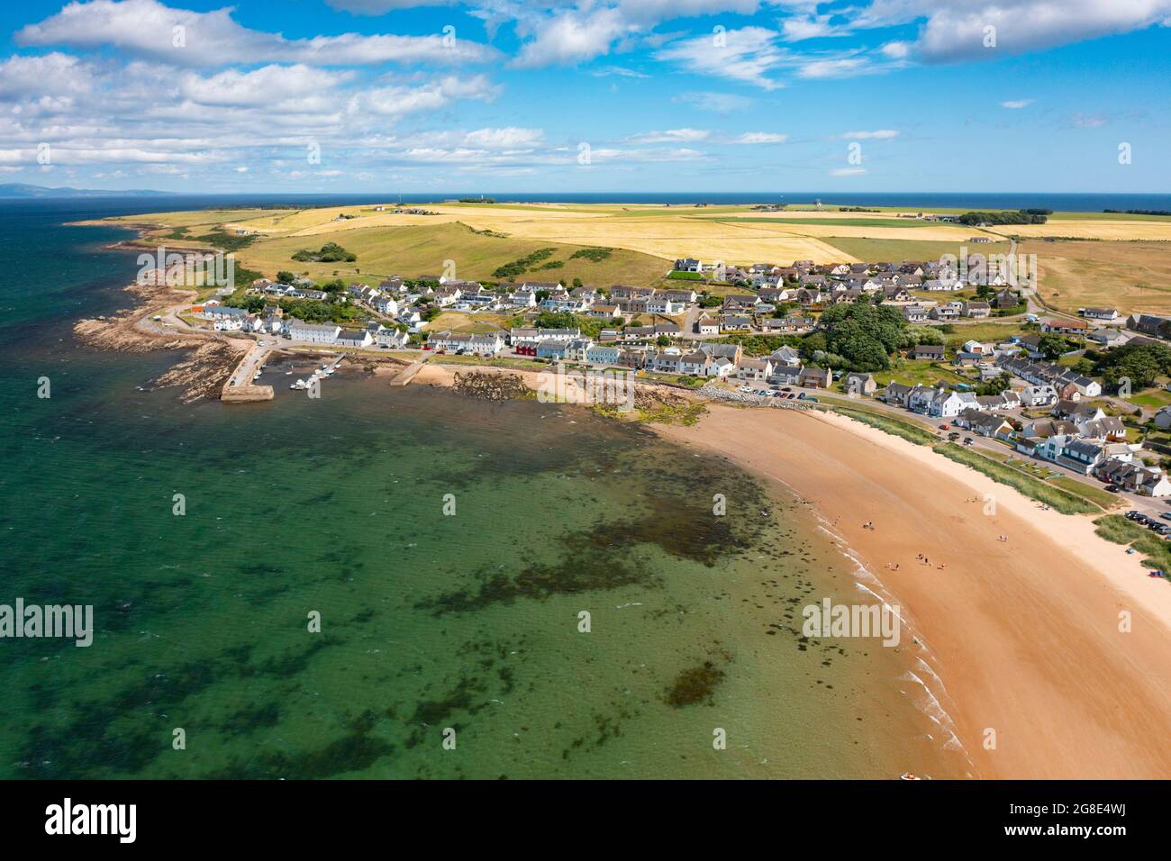 Aerial view from drone of Portmahomack village and beach, on Tarbat peninsula, Easter Ross, Scotland, UK Stock Photo