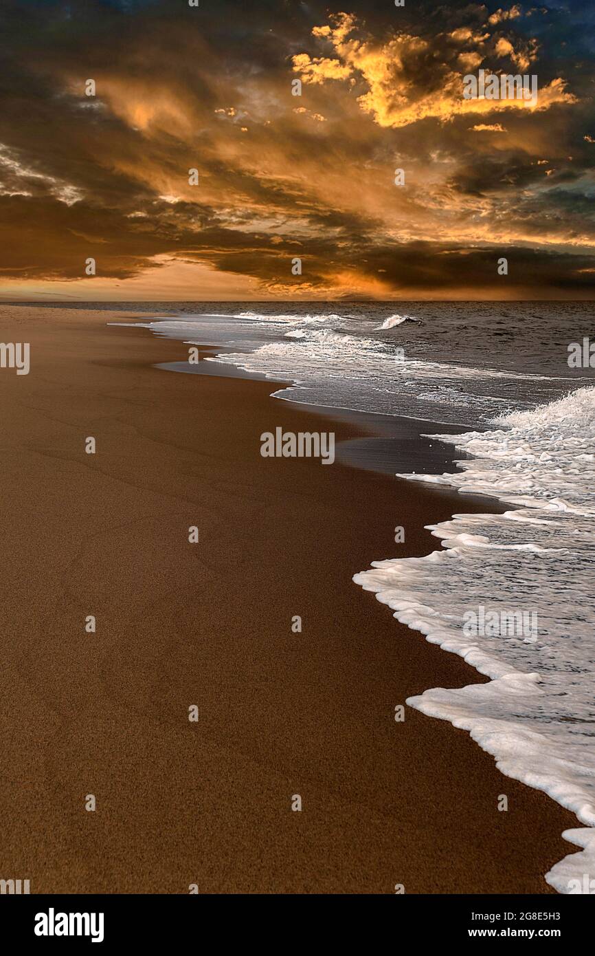 Waves on empty beach, dramatic cloudy sky at sunset, Race Point Beach, Cape Cod, Atlantic Coast, Massachusetts, New England, USA Stock Photo