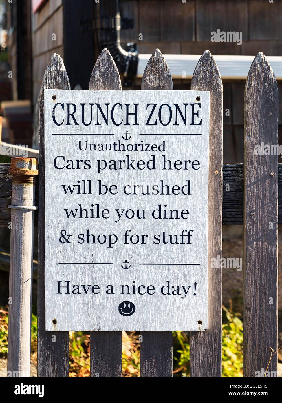 Sign in English with the inscription Crunch Zone and Smiley, warning to wrong parkers, Rockport, Cape Ann, Massachussets, USA Stock Photo