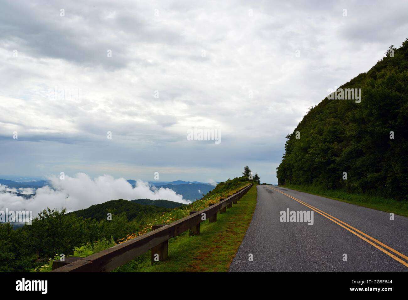 A section of the Blue Ridge Parkway that runs along the edge of the mountain in the Craggy Gardens area near Asheville, NC. Stock Photo