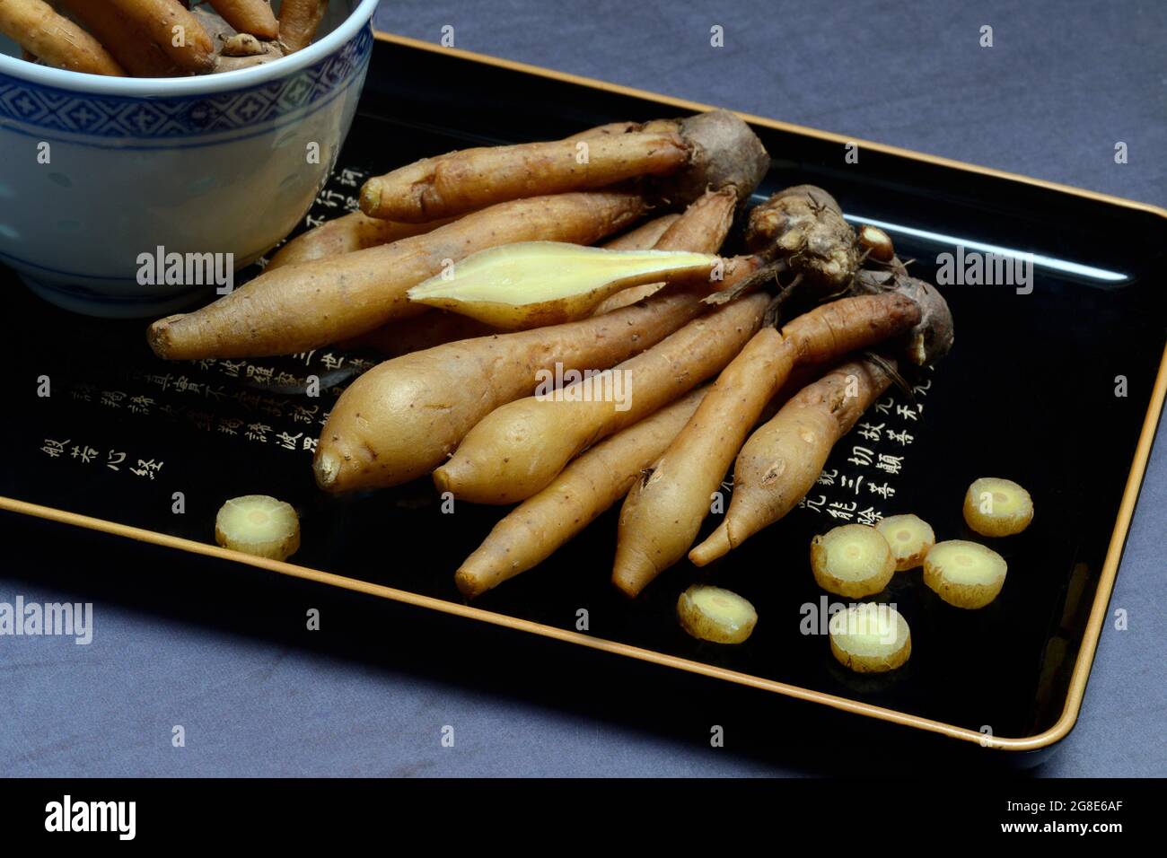 Fingerroot and knife on cutting board, Boesenbergia rotunda