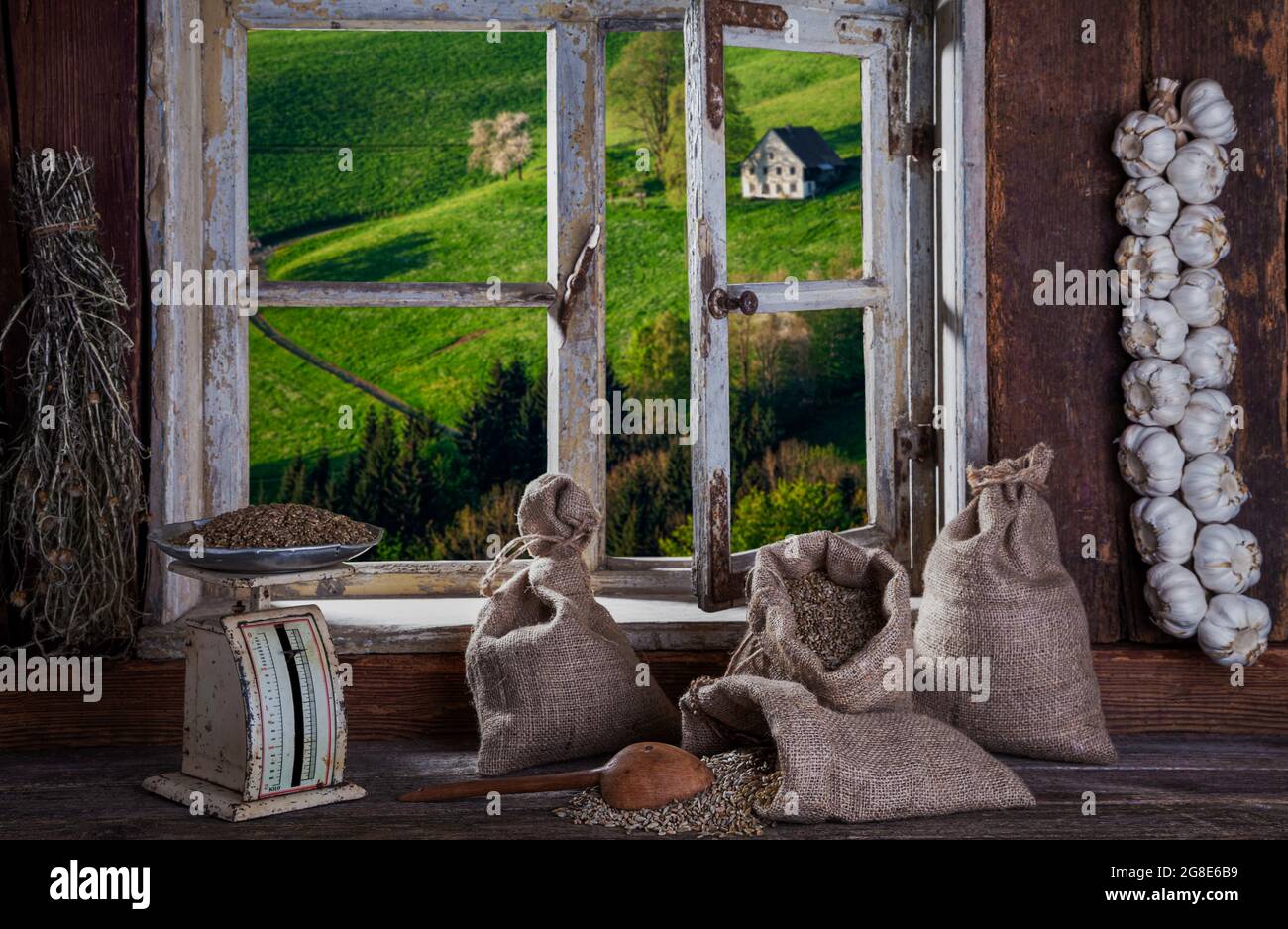 View from the farmer's kitchen with grain sacks and scales into the landscape, Black Forest, Baden-Wuerttemberg, Composing, Germany Stock Photo