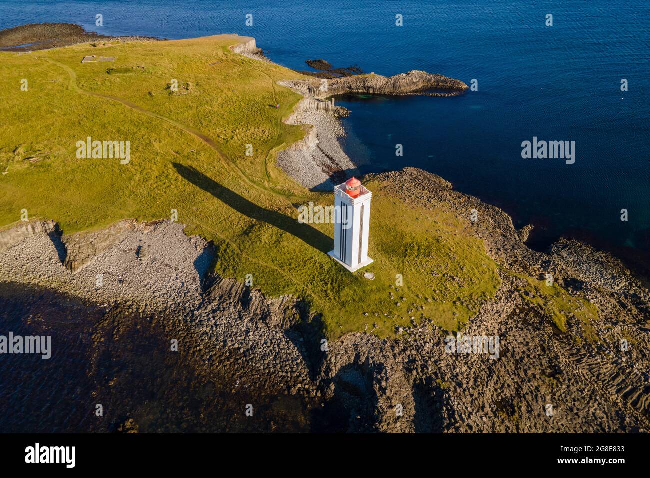 Lighthouse and coastal landscape with basalt formations, Kalfshamarsvik