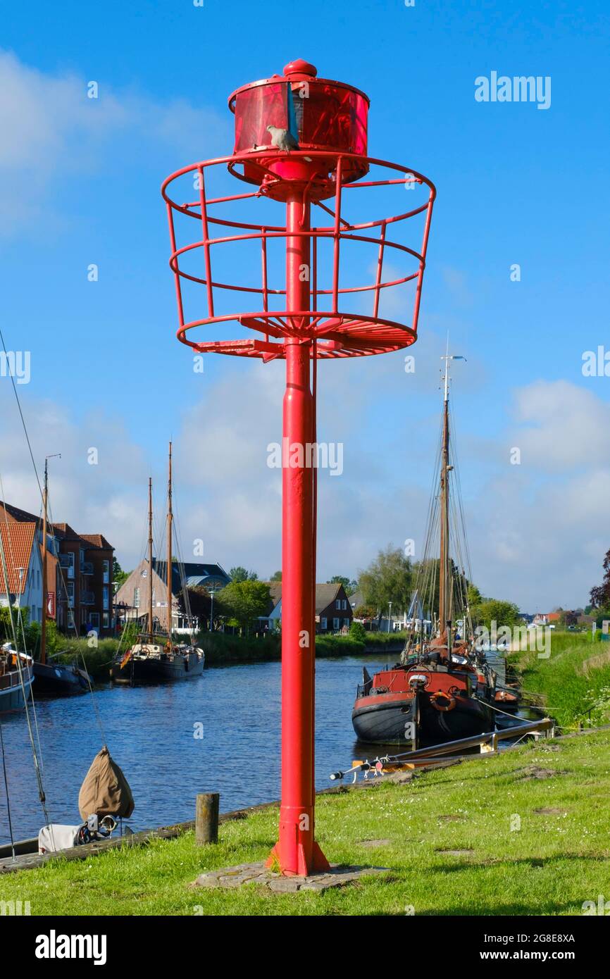 Mast with red position lamp in harbour, Carolinensiel, East Frisia, Lower Saxony, Germany Stock Photo