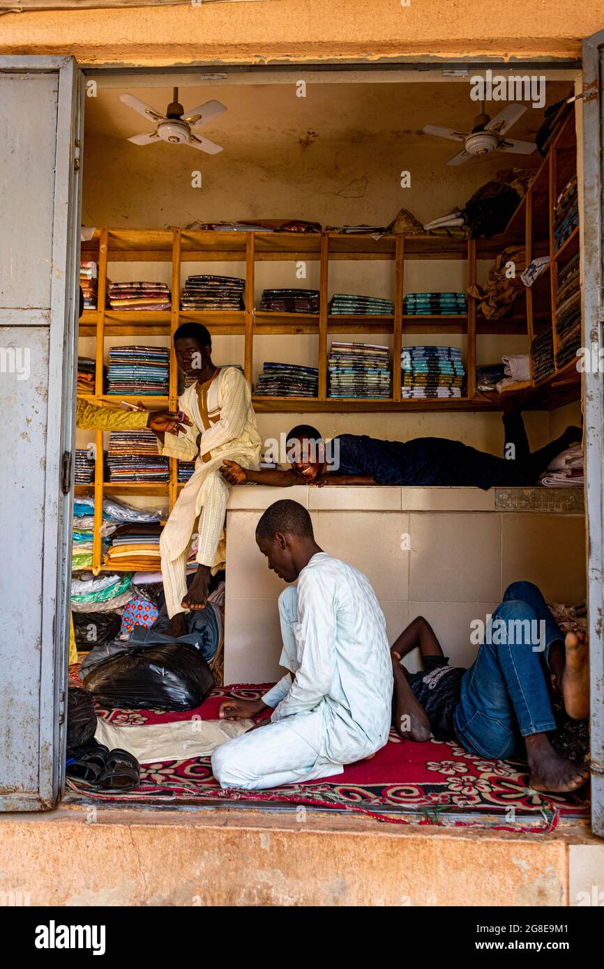 Boys hanging out in a shop in the bazaar, Kano, Kano state, Nigeria Stock Photo