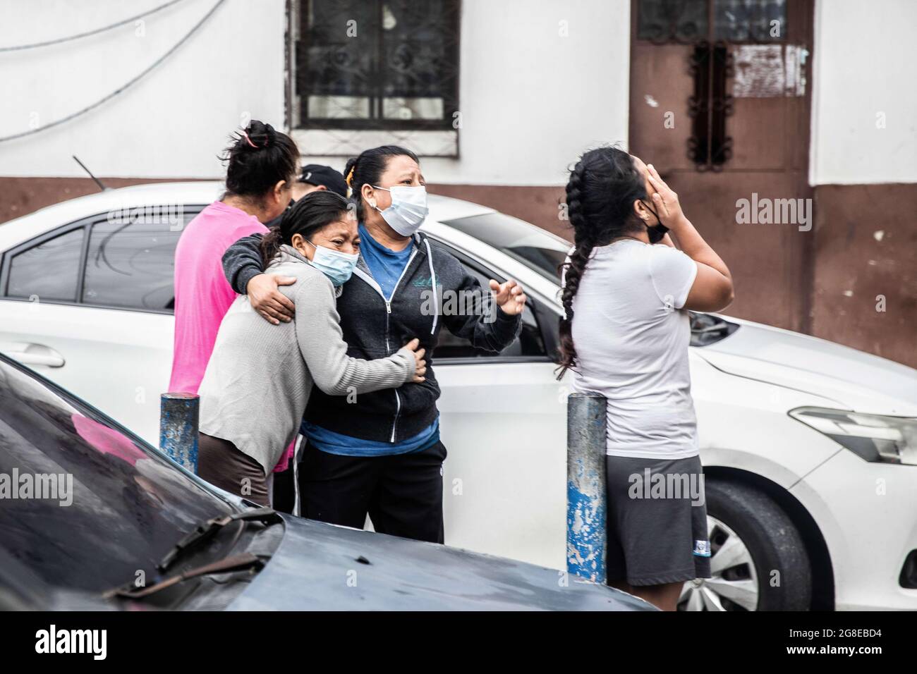 Guatemala City, Guatemala. 14th July, 2021. Life and Death in Guatemala. Gang problem and thug life of the lifeguard volunteers. Family of a member of the 18th street gang cries while he is getting arrested and moved by a large group of the police (Credit Image: © David Tesinsky/ZUMA Press) Stock Photo