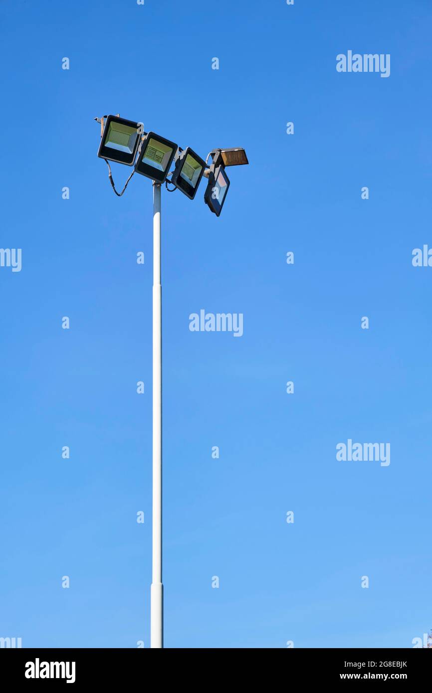 Lighting equipment of a sports field, off, during the day, against a clear sky. Image with copy space. Stock Photo