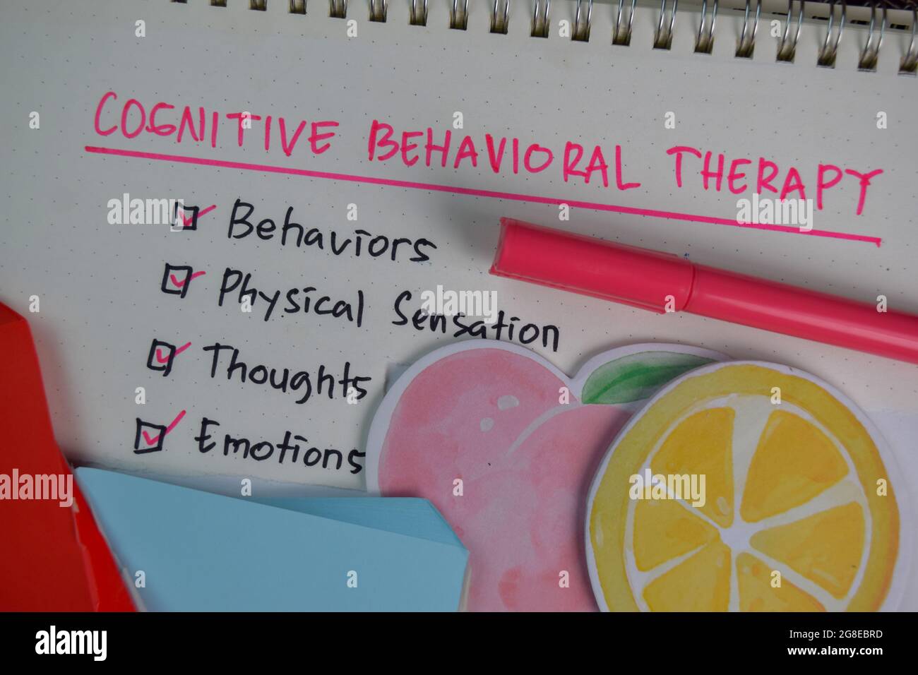 Cognitive Behavioral Therapy write on a book with keywords 