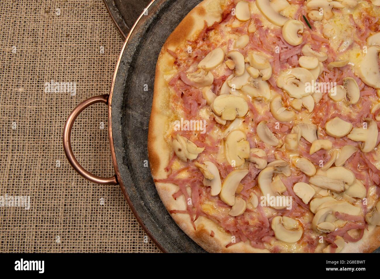 Brazilian mushroom, cheese and ham pizza, top view Stock Photo