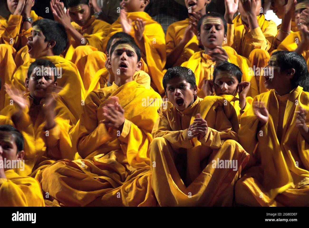 Ecstatic worshippers at the sunset aarti ceremony on the banks of the ...