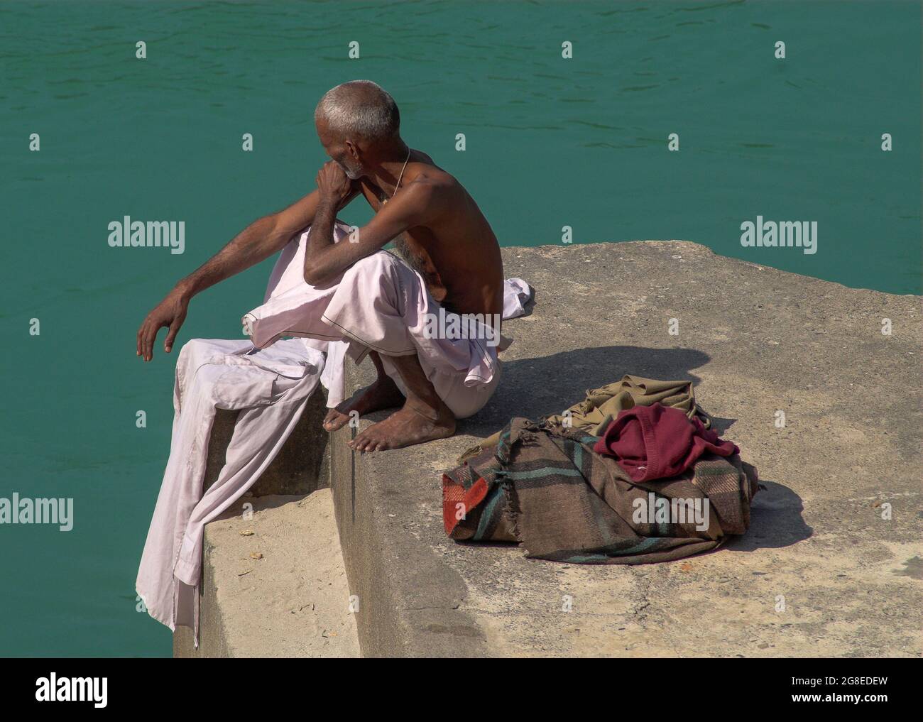 Pilgrimage Rishikesh Pilgrim contemplating the holy Ganges at Rishikesh, Uttaranchal, India ...