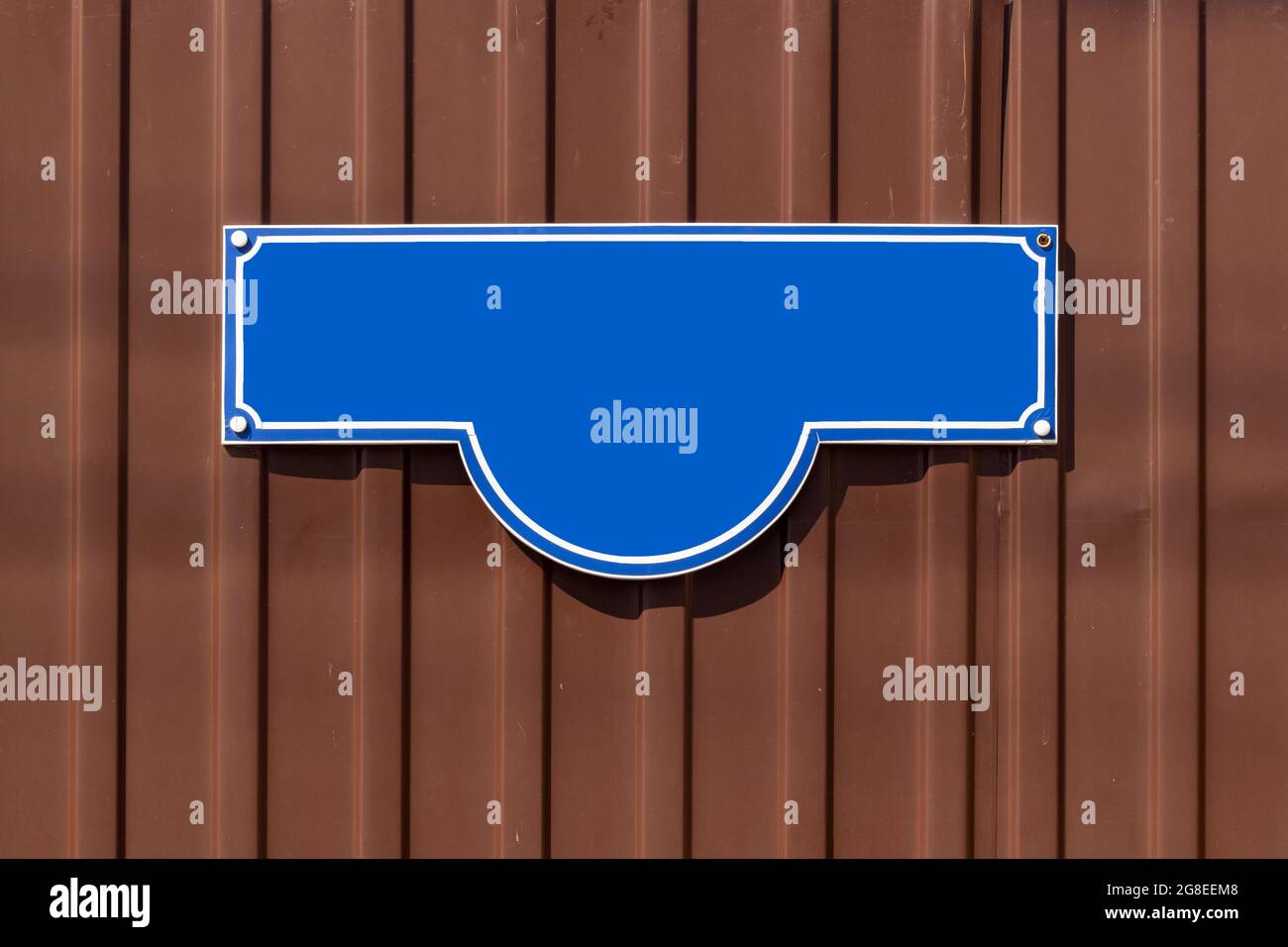 A blue address sign on the fence of a private house Stock Photo Alamy