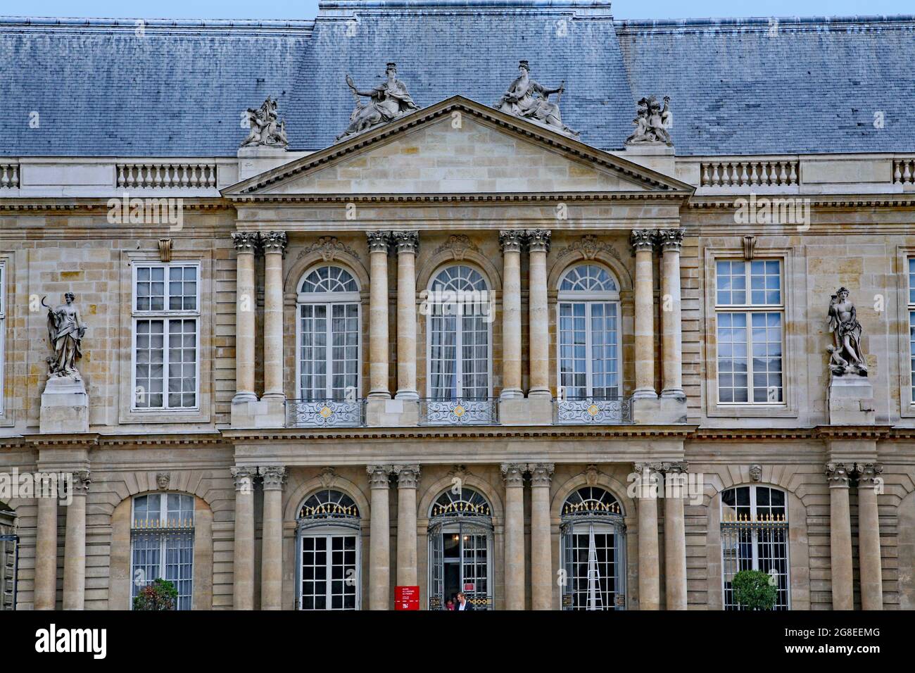 Paris, France :  The ornate baroque facade of the French National Archives museum in the Marais district, housed in the 18th century Soubise palace, b Stock Photo