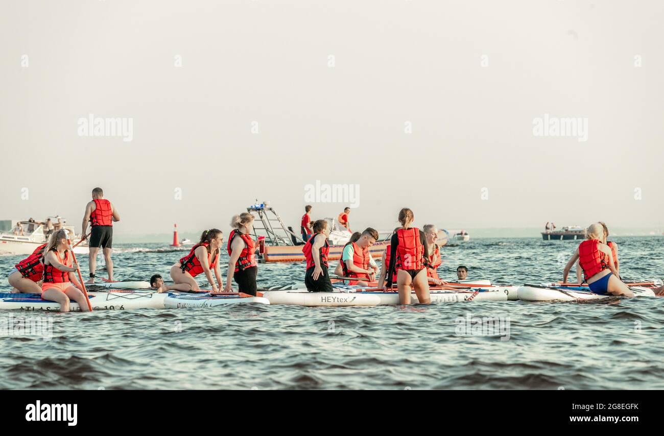 Sup Team SUP board training team gather in the water of Finnish Gulf, St ...
