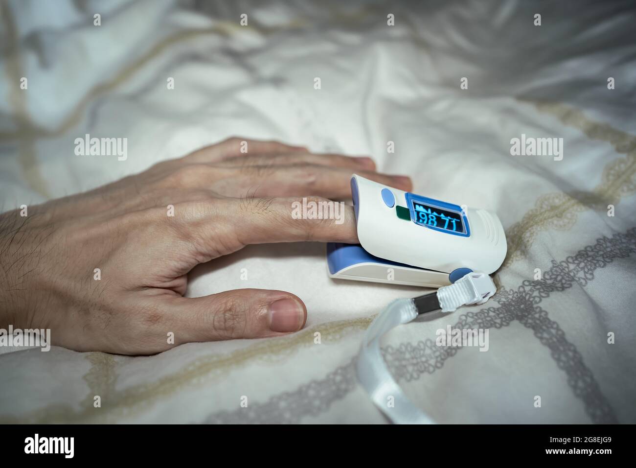 https://c8.alamy.com/comp/2G8EJG9/a-pulse-oximeter-may-help-to-detect-the-covid-19-symptom-if-the-oxygen-level-is-lower-than-92-it-is-the-sign-of-covid-19-infection-2G8EJG9.jpg