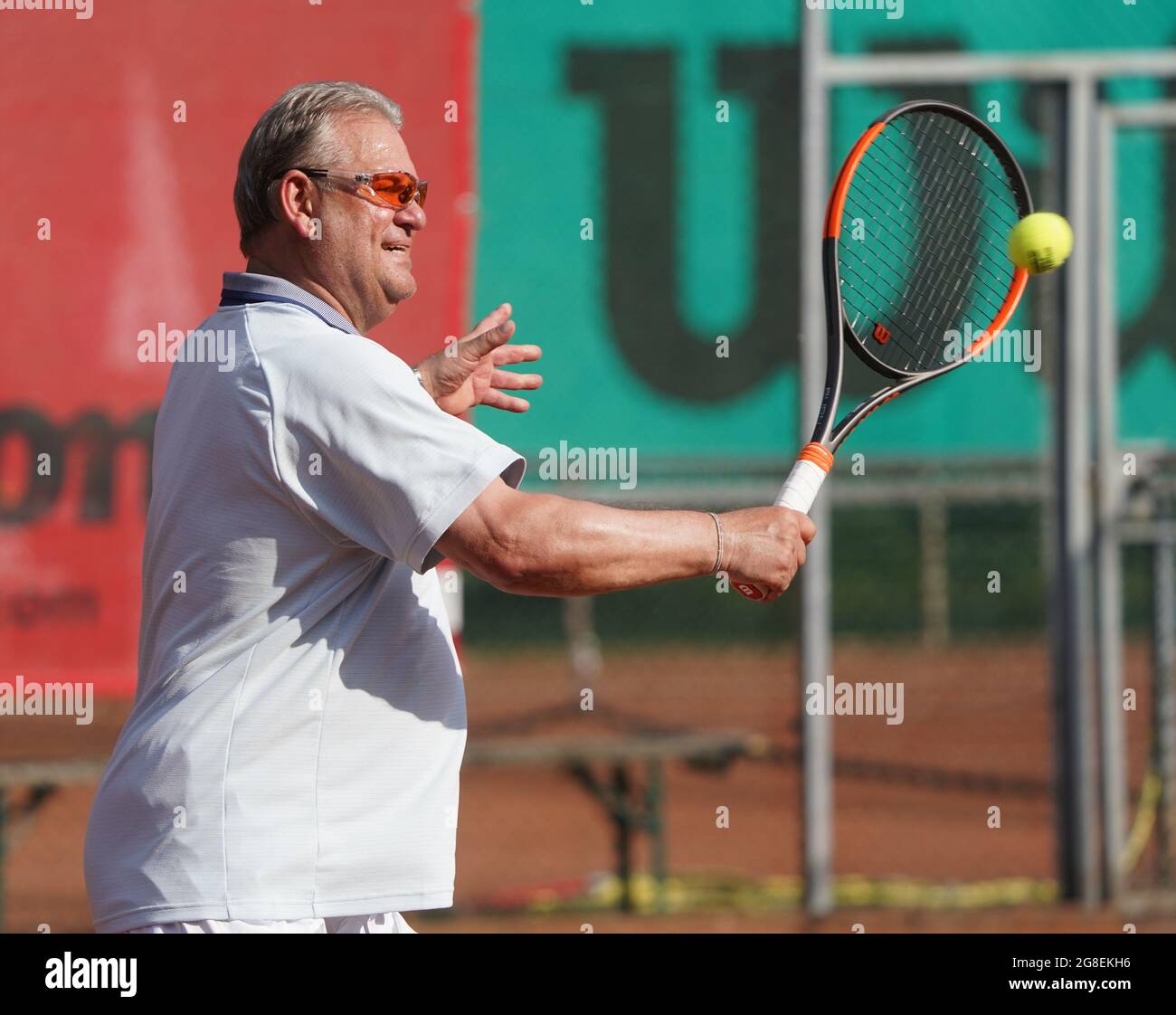 Hamburg, Germany. 15th July, 2021. Frank Pagelsdorf, former coach of  Hamburger SV and Hansa Rostock, hits a ball on the tennis court of SC  Condor. Credit: Marcus Brandt/dpa - IMPORTANT NOTE: In