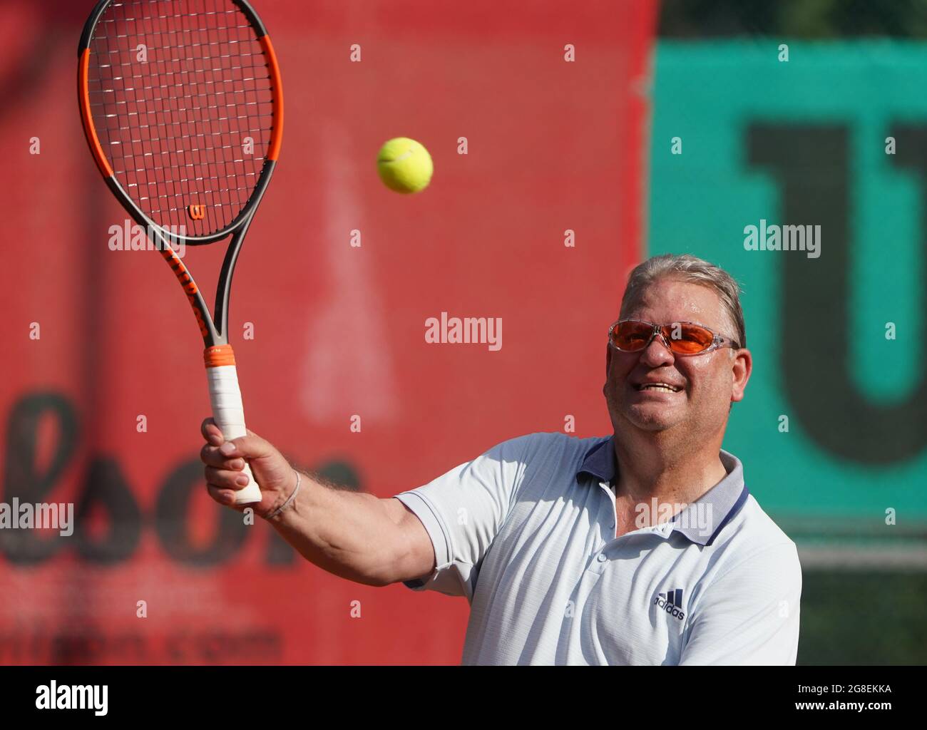 Hamburg, Germany. 15th July, 2021. Frank Pagelsdorf, former coach of  Hamburger SV and Hansa Rostock, hits a ball on the tennis court of SC  Condor. Credit: Marcus Brandt/dpa - IMPORTANT NOTE: In