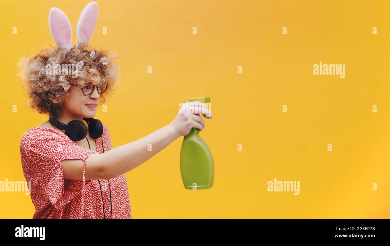 Naughty girl in jolly mood wearing cute bunny ears hairband and