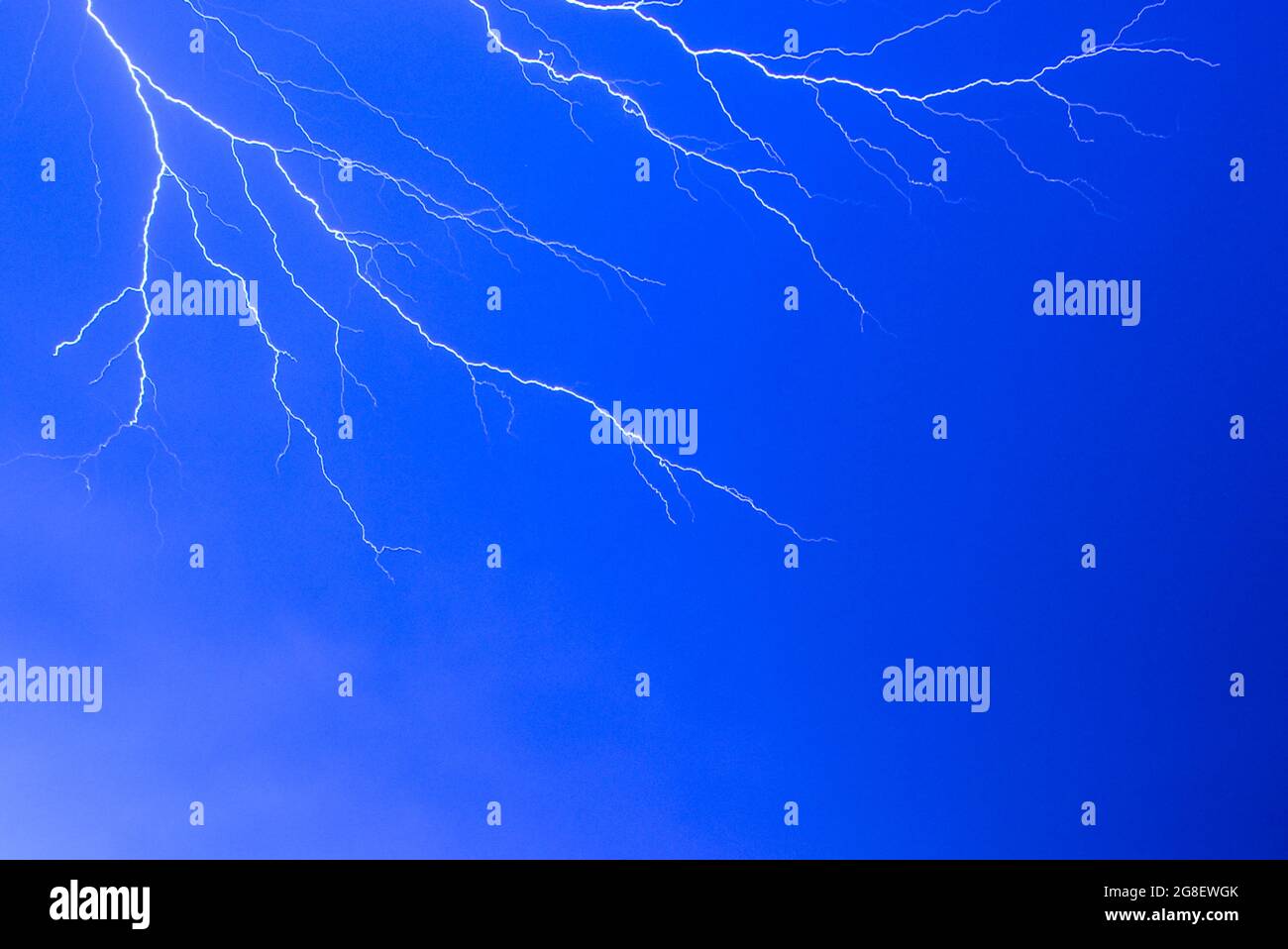 Low angle shot of the blue clear sky with lightning - for backgrounds ...