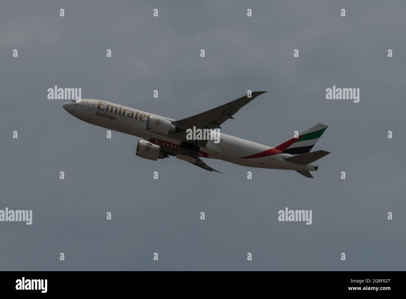 Hong Kong, China, 17 Jul 2021, A Boeing 777F cargo plane of Emirates Airlines takes off from Hong Kong International Airport. Stock Photo