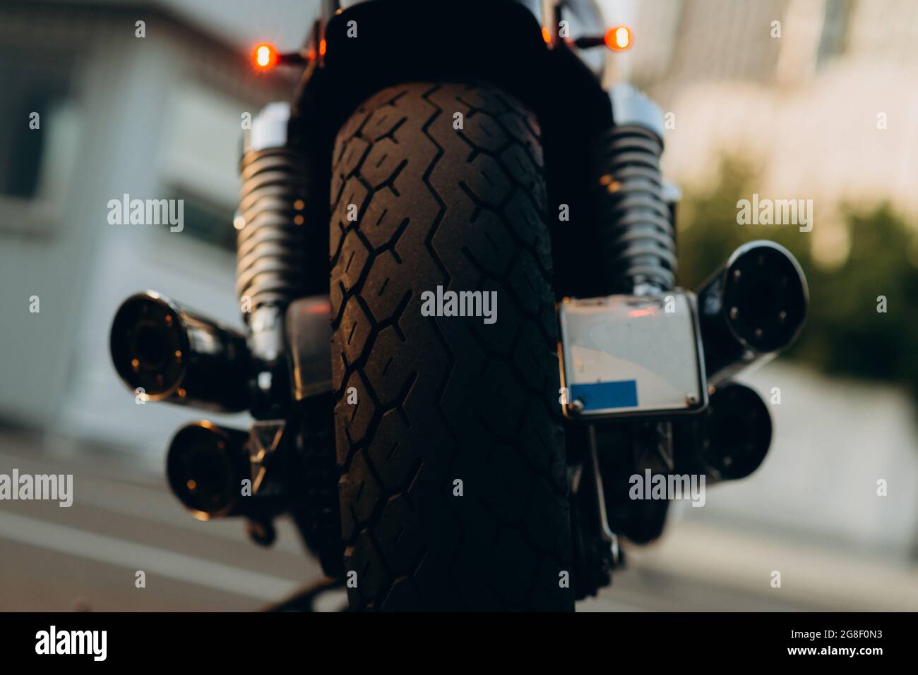 Motorcycle in the parking lot, rear view. Tire tread and chrome