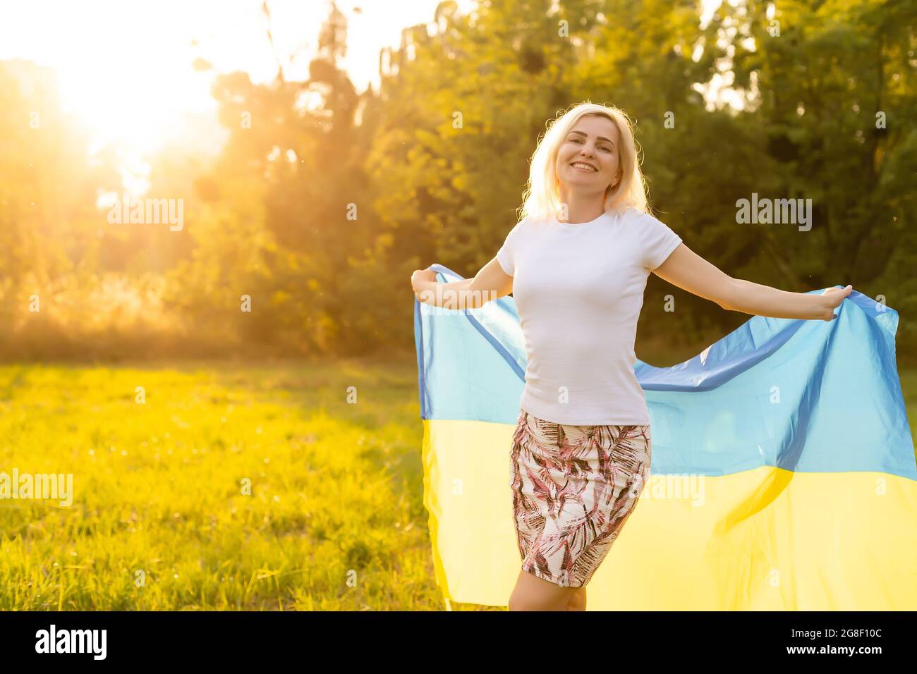 beautiful woman holding a flag of Ukraine Stock Photo Alamy