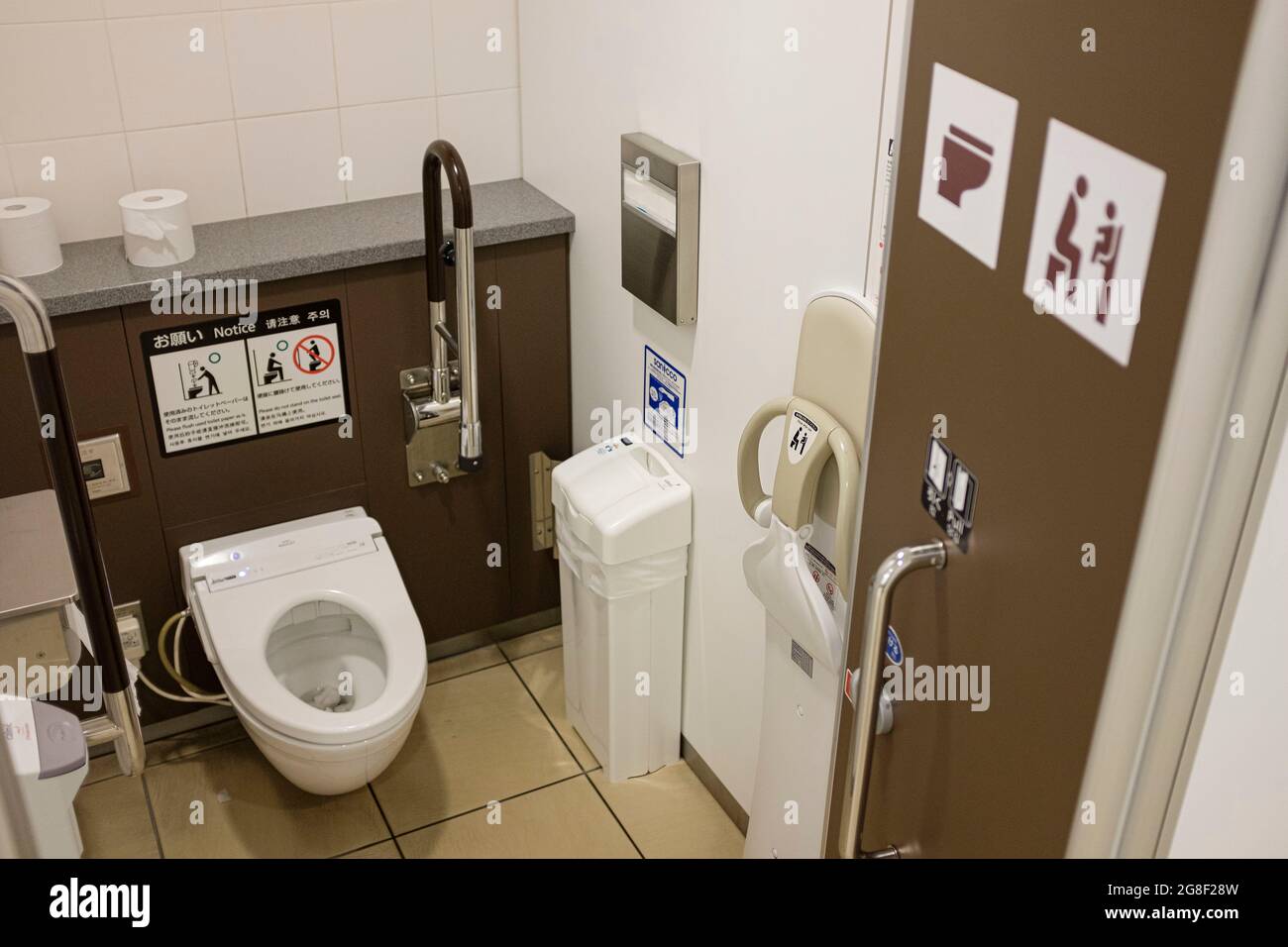 Tokyo, Japan. 19th July, 2021. Japanese toilet for mother with child at Haneda Airport, with an