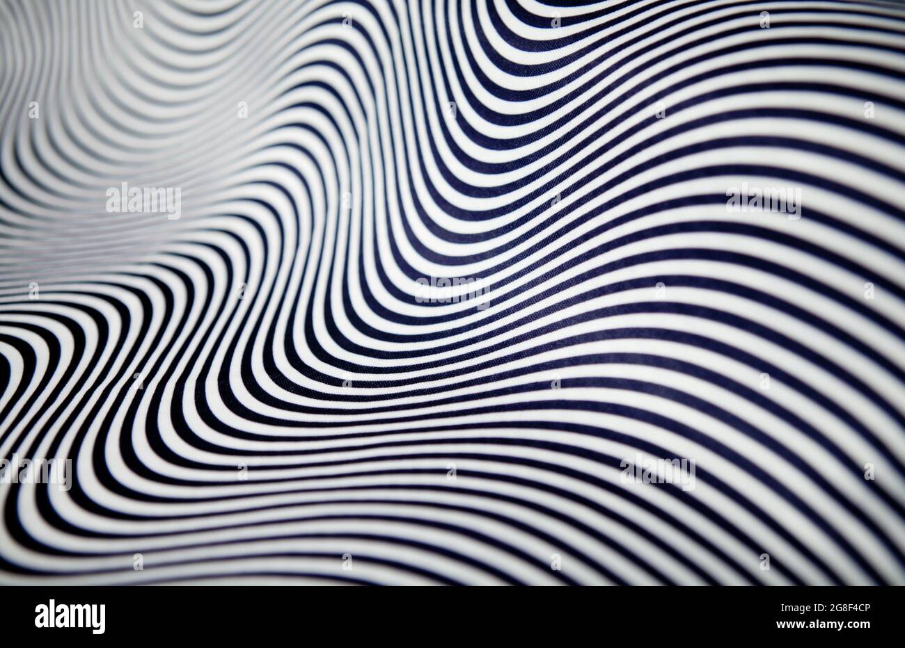 Geometric striped abstract optical illusion, pattern. Black and white vibrant parallel curves, web background. Multi exposure. Stock Photo