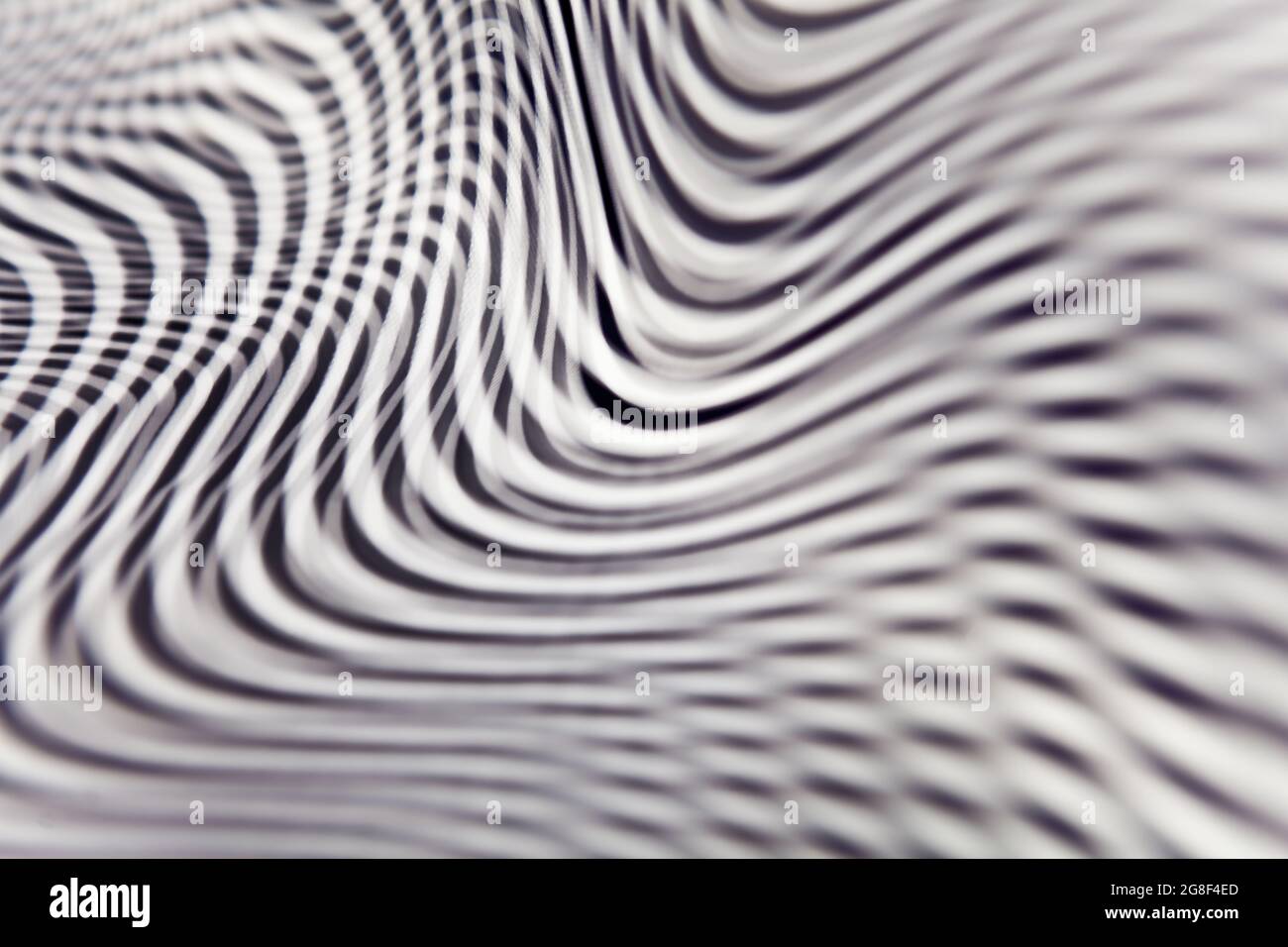 Geometric striped abstract optical illusion, pattern. Black and white vibrant parallel curves, web background. Multi exposure. Stock Photo