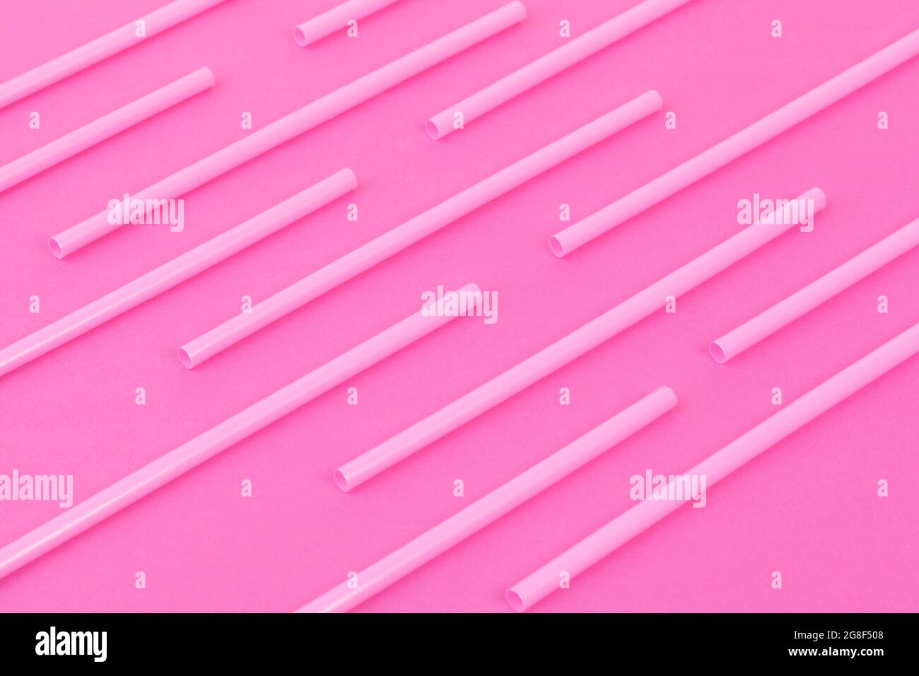 Drinking straws on bright pink background, top view Stock Photo