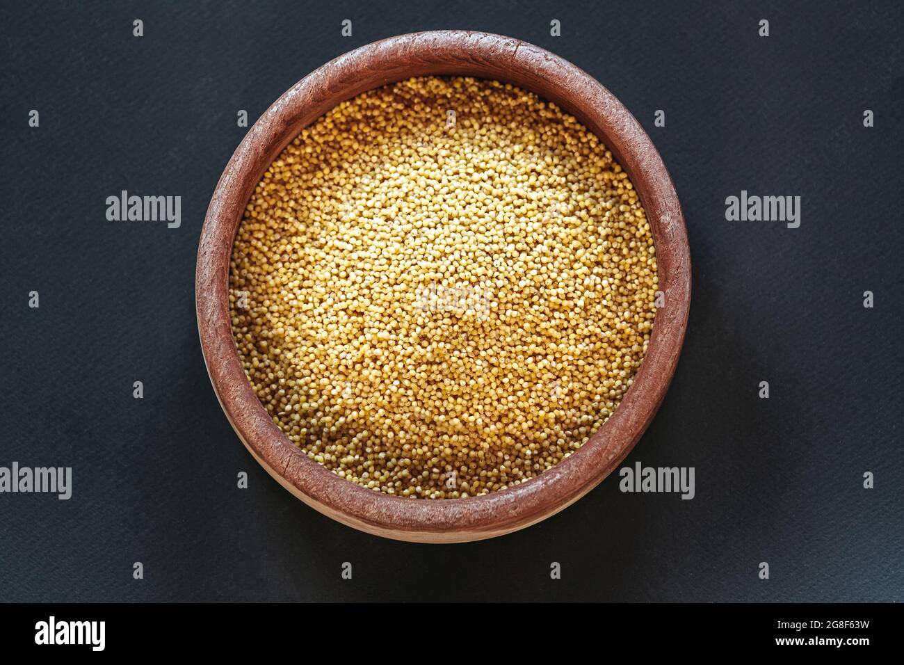 A cereals millet in wooden bowls top view Stock Photo Alamy