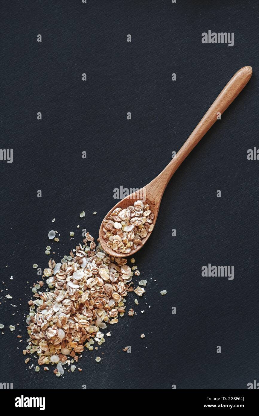 A cereals oat in wooden or bamboo spoon top view Stock Photo