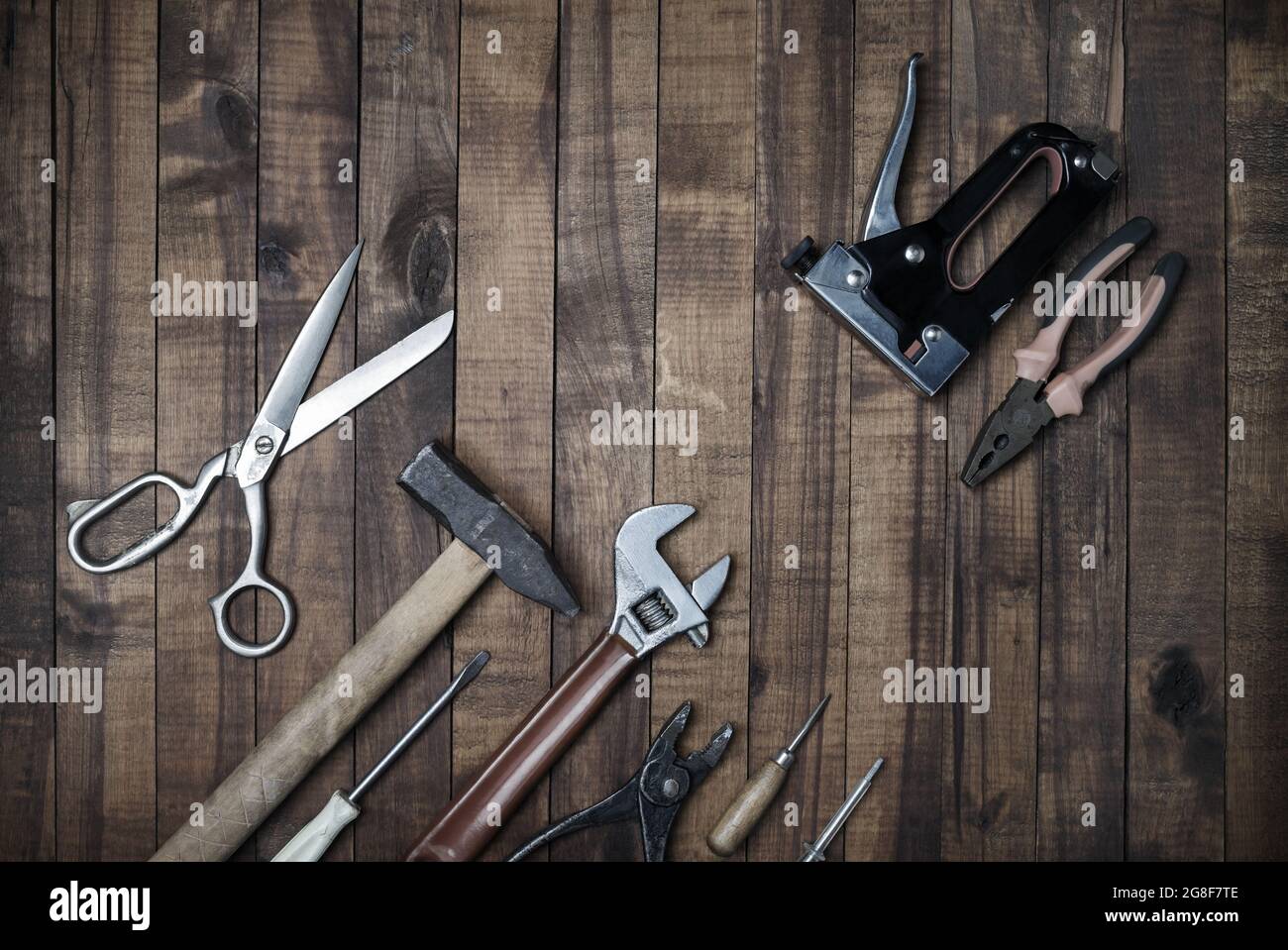 Used work tools on wooden background. Top view. Flat lay. Stock Photo